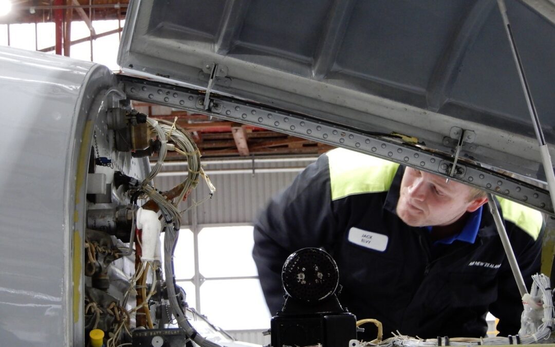 Jack Elvy from Air New Zealand inspecting the nose avionics compartment during a daily inspection of a Mitsubishi MU-2